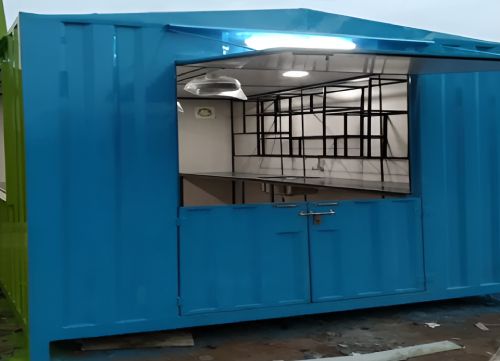 Portable container retail shop cabin with open serving counter and interior shelving